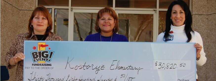 Kostoryz Estates Elementary School fundraising team holding check