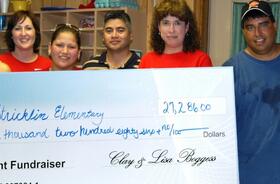 Refugio Elementary School fundraising team holding check