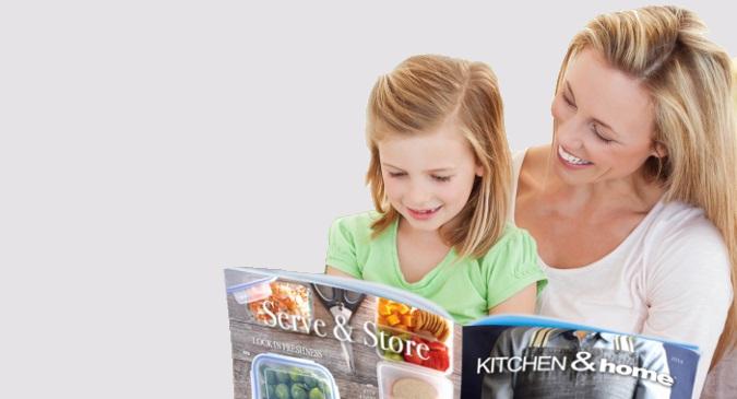 Mom and daughter looking through fundraiser brochure