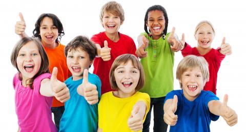 School students giving a thumbs up