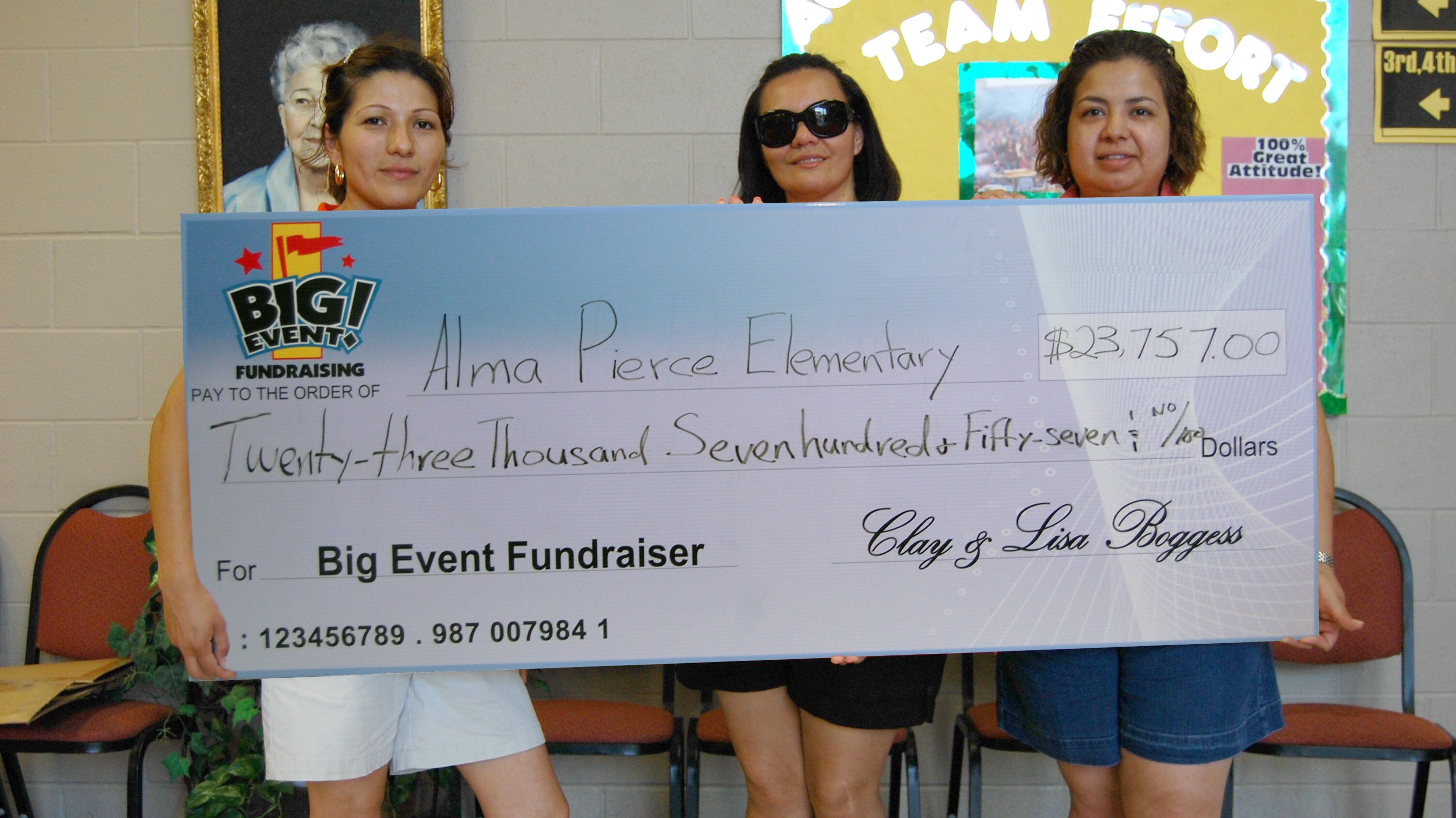 Students Have Wonderful Time at Super Splash Party Alma Pierce Elementary School fundraising team holding check