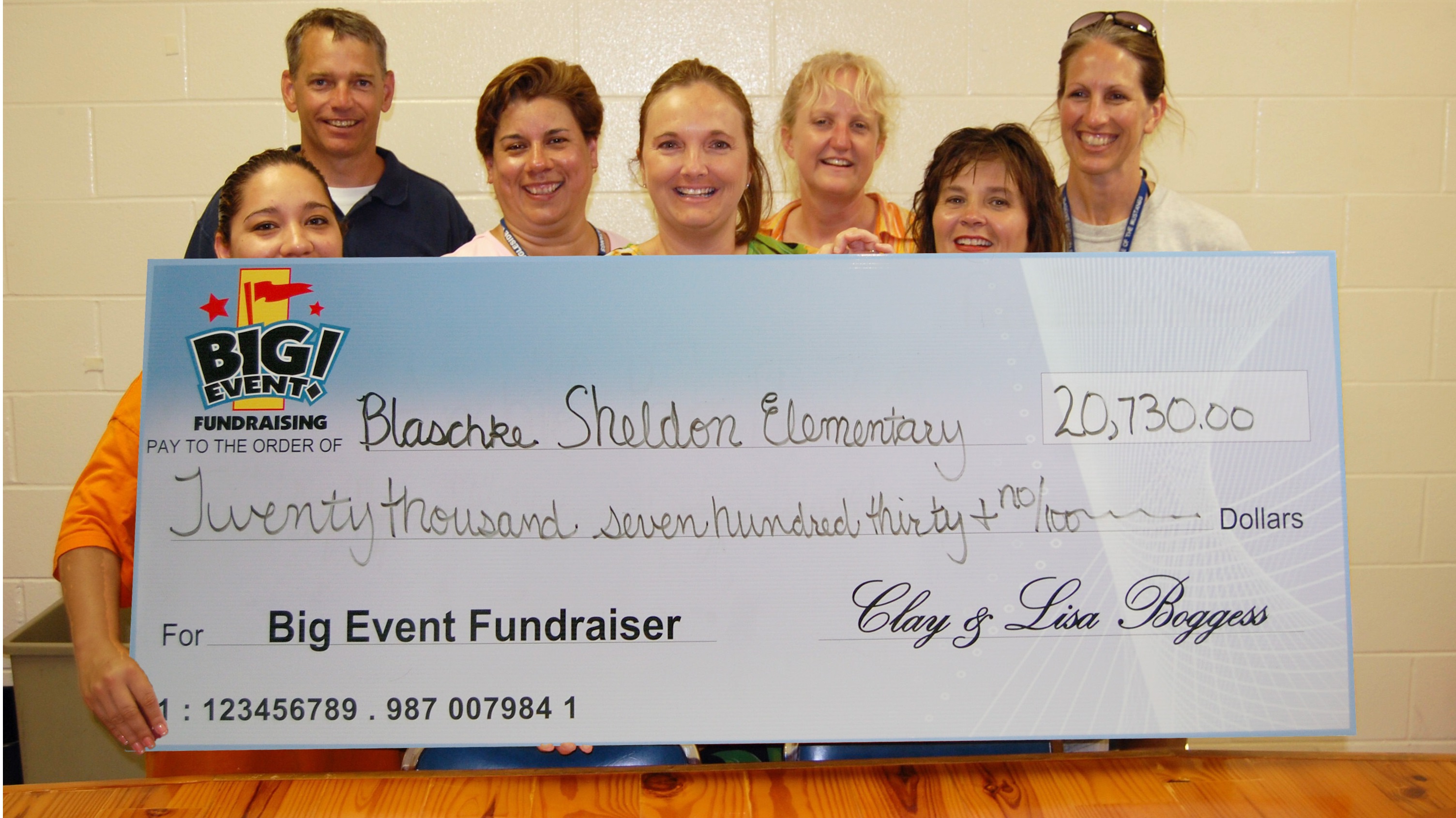 Super Splash Party is Great Sales Motivator Blaschke Sheldon Elementary School fundraising team holding check