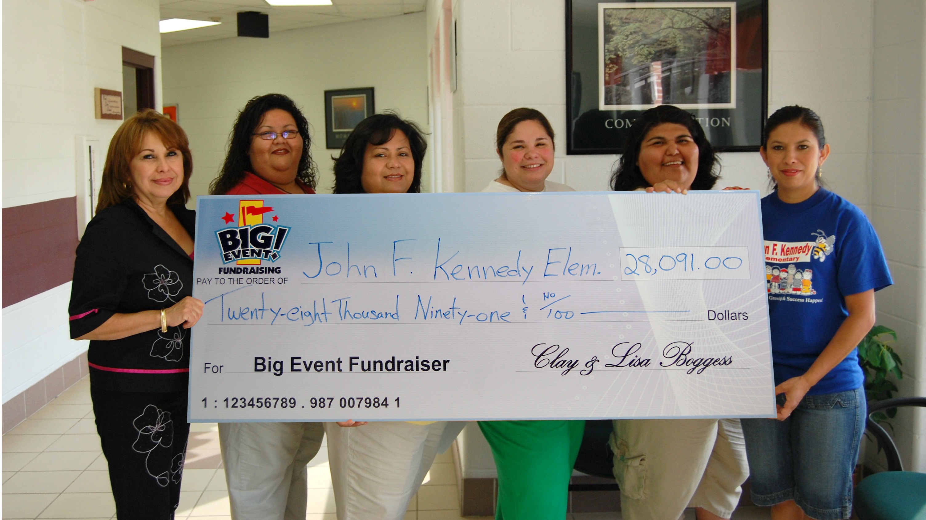Everything Ran Smoothly with Big Fundraising Ideas John F. Kennedy Elementary School fundraising team holding check