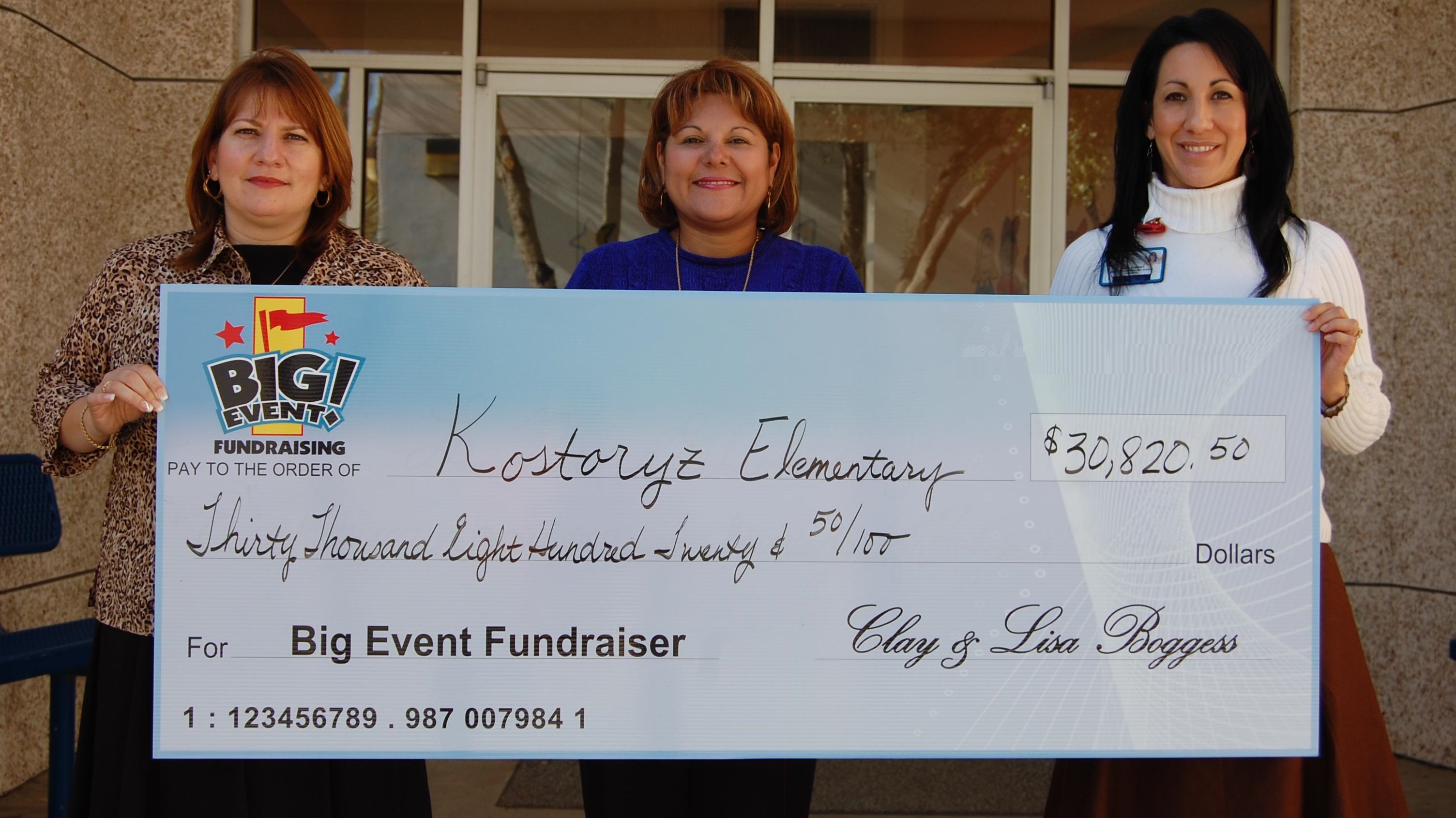 Elementary Students Experience Great Super Party Kostoryz Elementary School fundraising team holding check