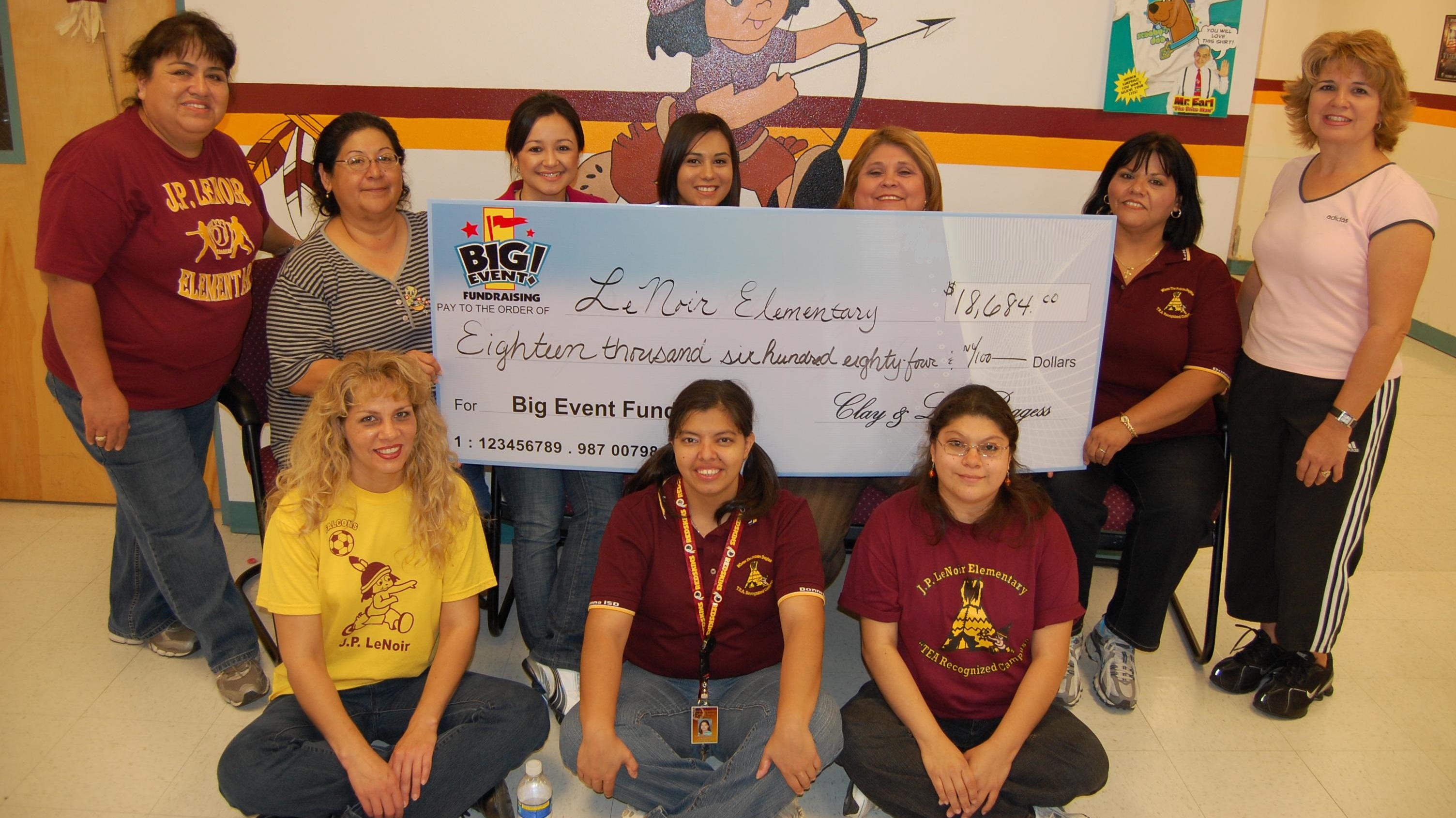 Helpful Support Provided to Elementary School Le Noir Elementary School fundraising team holding check