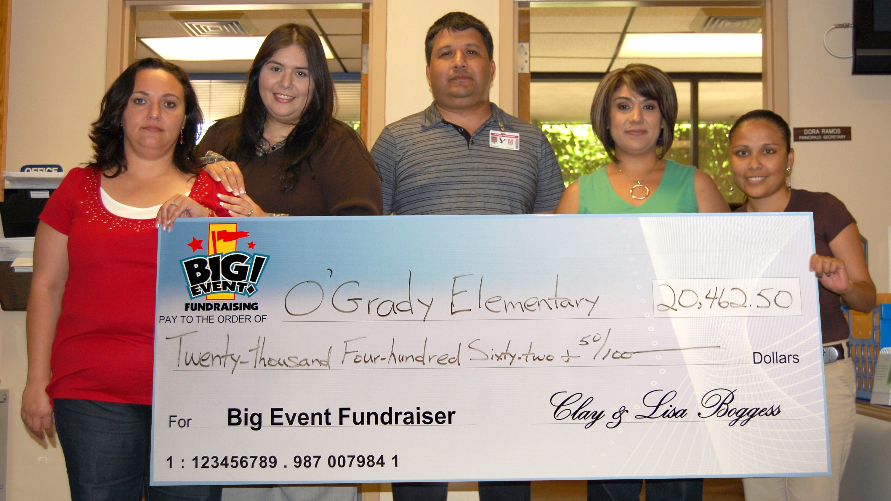 School Has Most Profitable Fundraiser Ever O'Grady Elementary School fundraising team holding check
