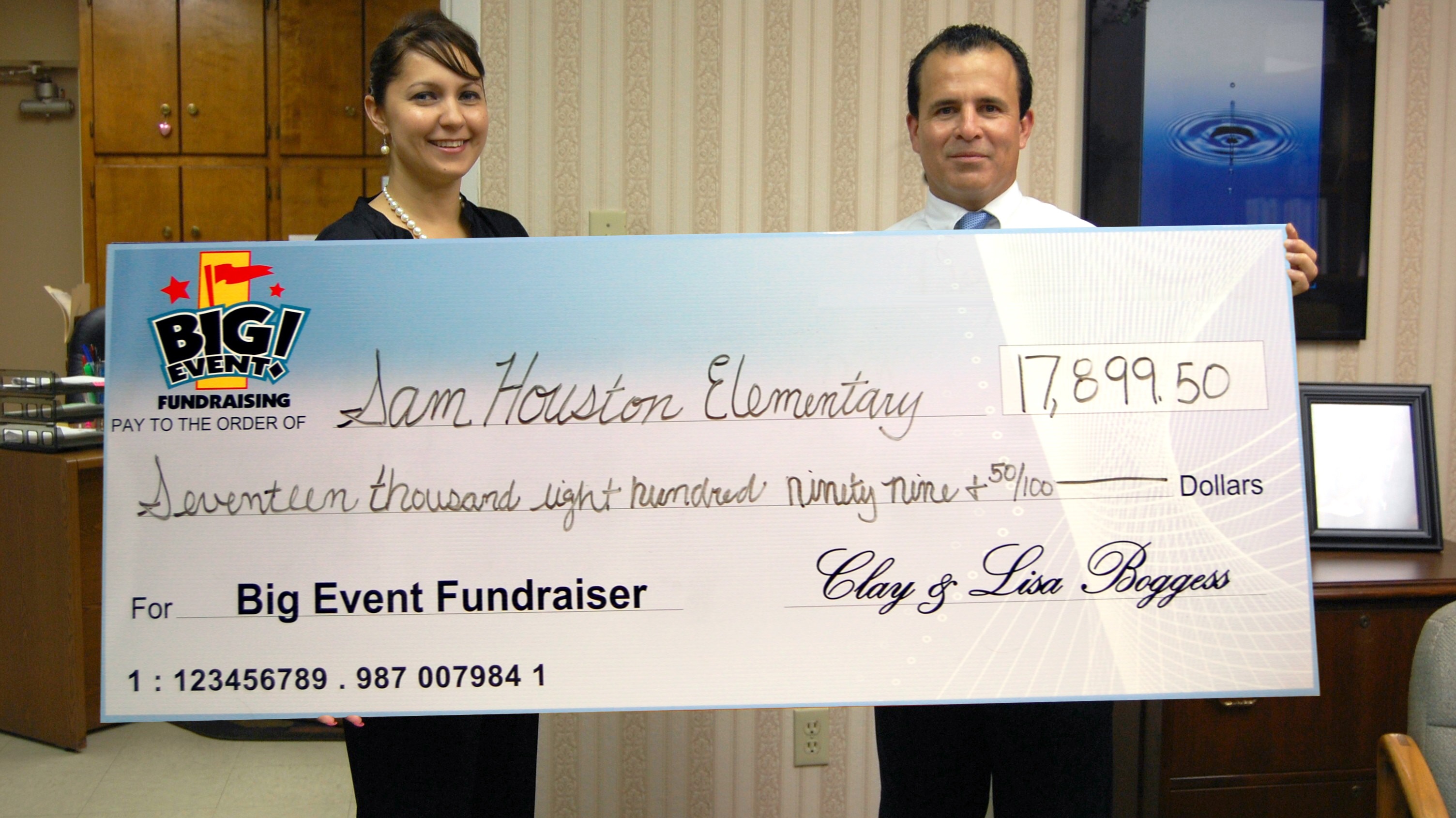 Principal Recommends Splash Party Sam Houston Elementary School fundraising team holding check