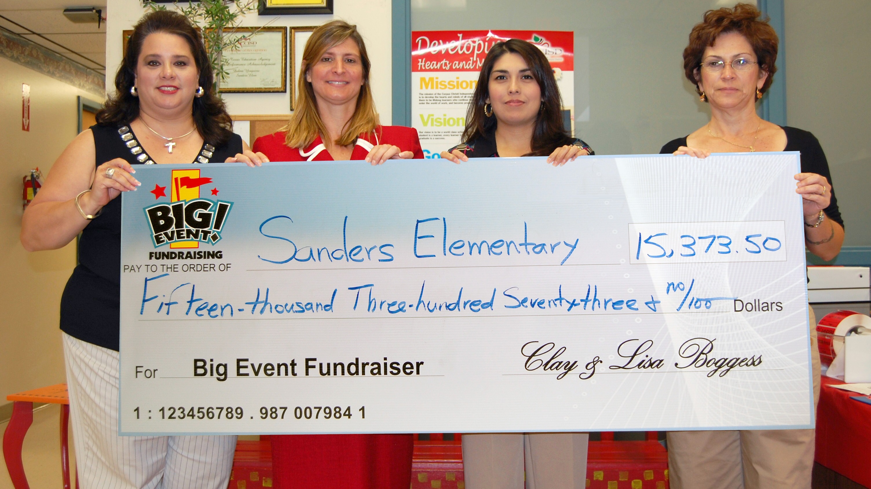 Sanders Elementary School fundraising team holding check