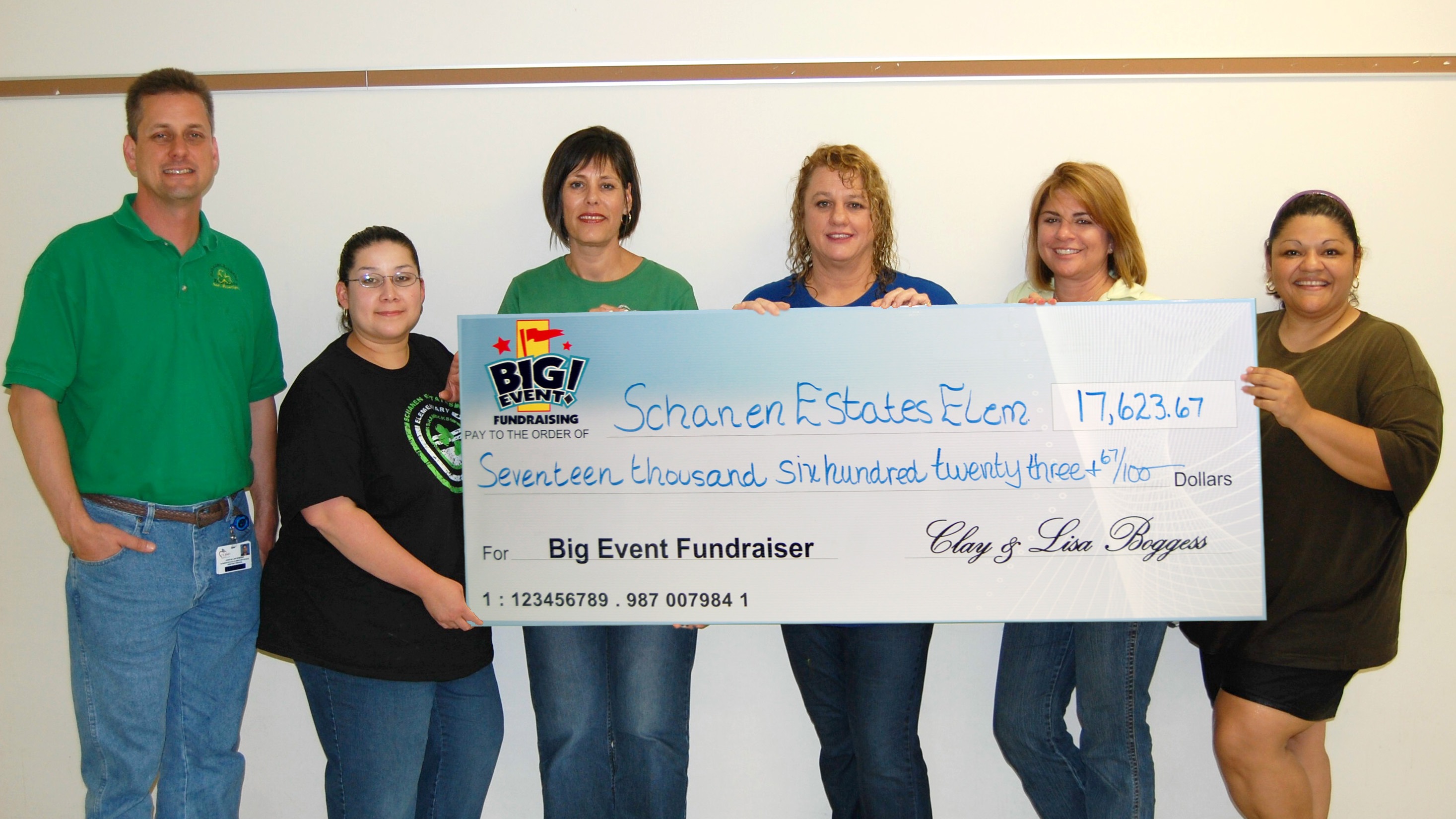 PTA Rates Fundraising Company Service Very Good Schanen Estates Elementary School fundraising team holding check