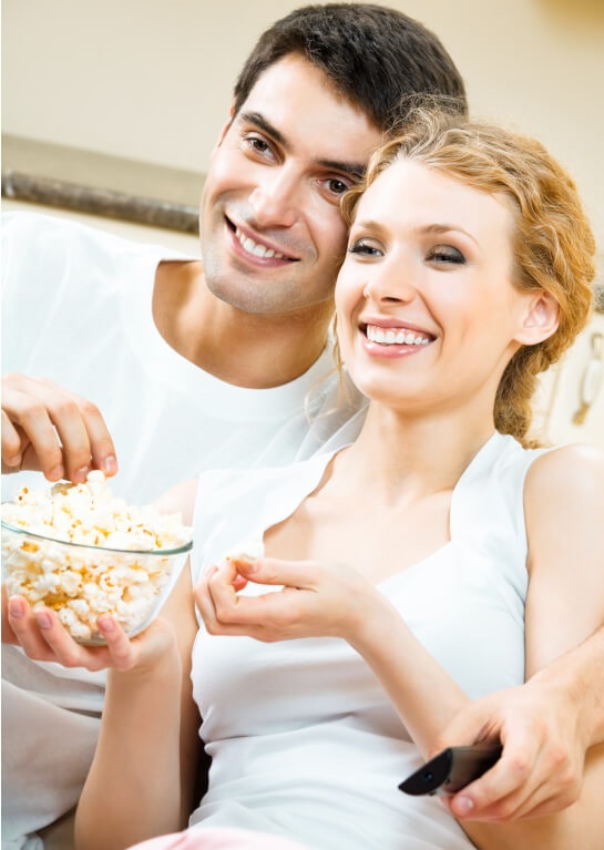 2 college students enjoying popcorn