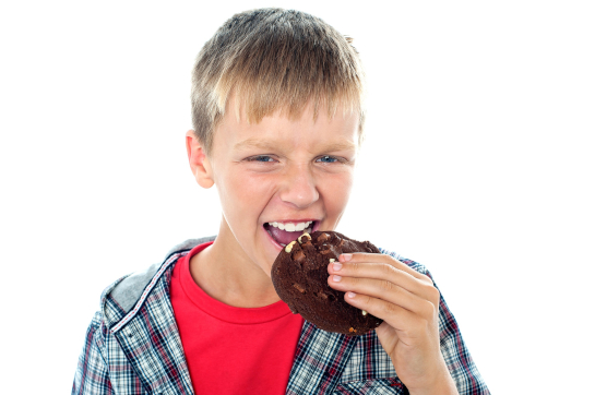 Boy eating cookie