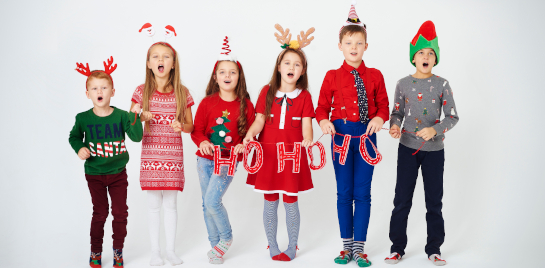 Elementary students wearing reindeer hats