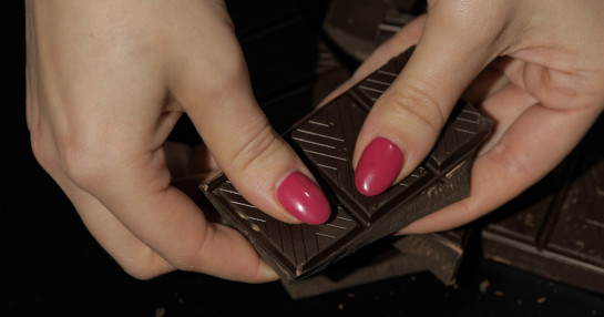 Girl Holding Chocolate Candy Bar