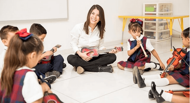 Preschool music teacher with students
