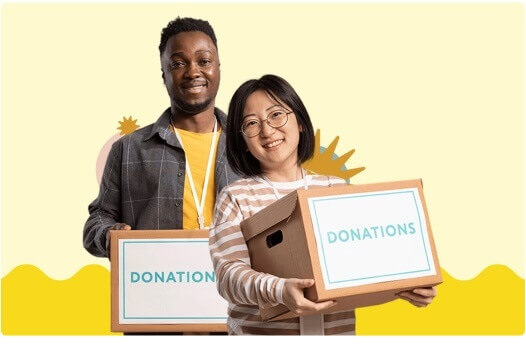 Two people holding donation boxes