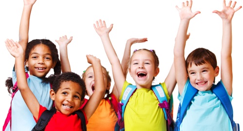 Smiling elementary school student with arms raised