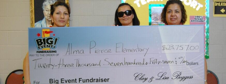 Alma Pierce Elementary School fundraising team holding check