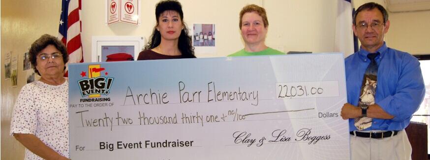 Archie Parr Elementary School fundraising team holding check