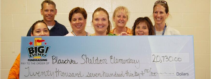 Blaschke Sheldon Elementary School fundraising team holding check