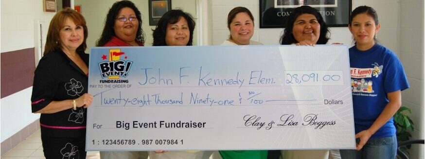 John F. Kennedy Elementary School fundraising team holding check