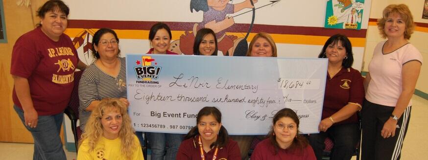School Jumps at Chance to Have Super Party Le Noir Elementary School fundraising team holding check