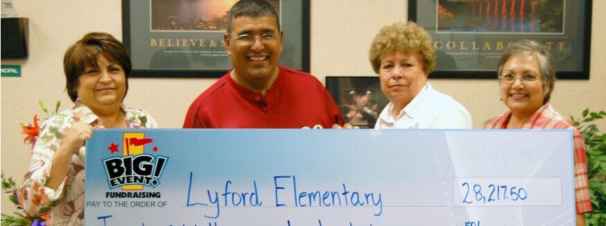 Super Party Wonderful for Elementary Students Lyford Elementary School fundraising team holding check