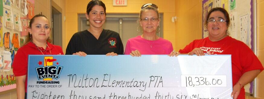 Milton Elementary School PTA fundraising team holding check