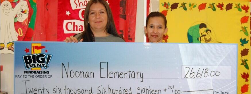 Noonan Elementary fundraising team holding check