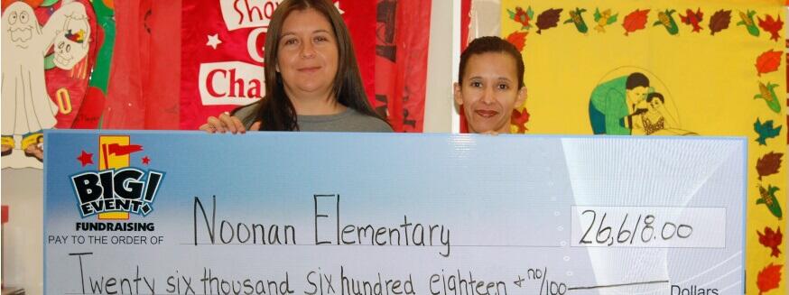 Noonan Elementary School fundraising team holding check