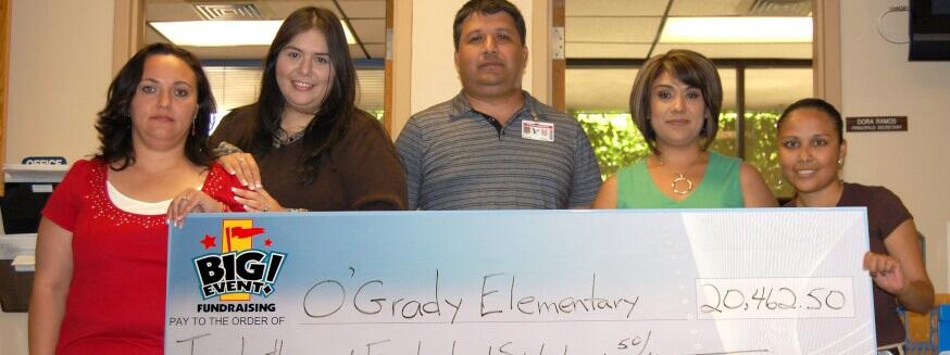 O'Grady Elementary School fundraising team holding check