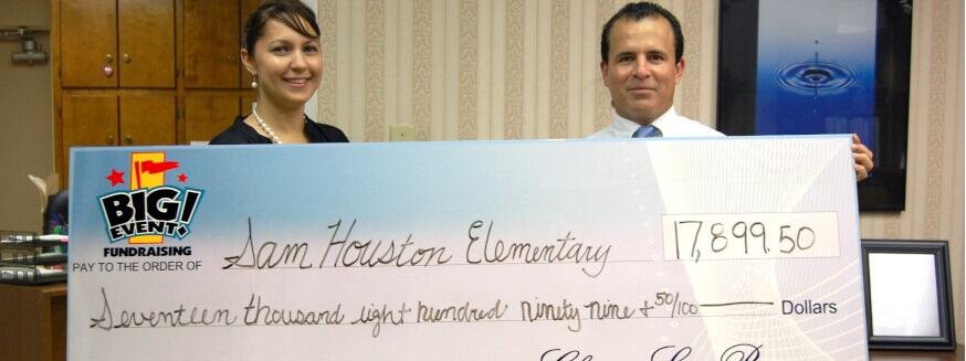 Fundraiser Company is Always Helpful Sam Houston Elementary School fundraising team holding check