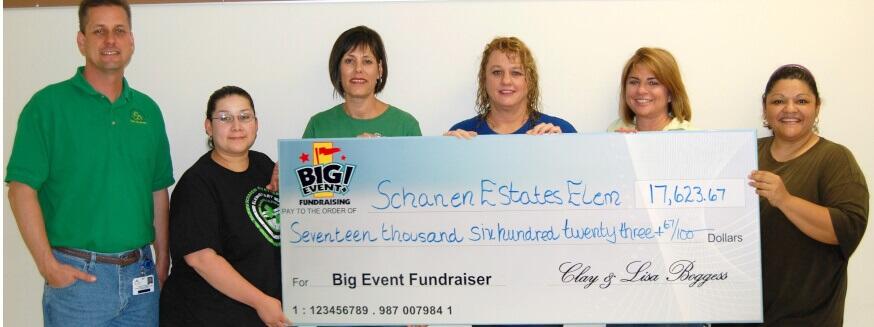 Schanen Estates Elementary School fundraising team holding check