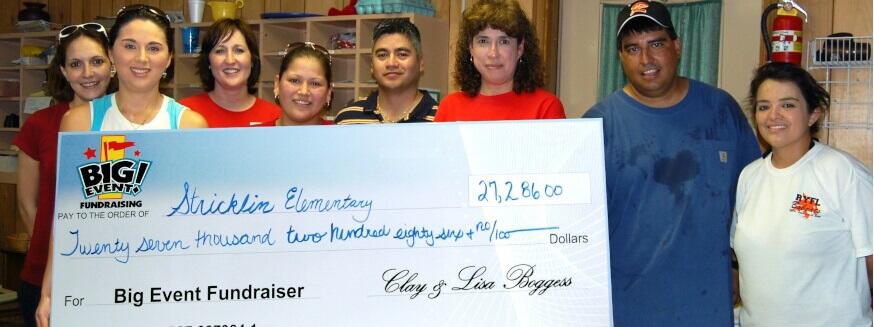 Stricklin Elementary School fundraising team holding check