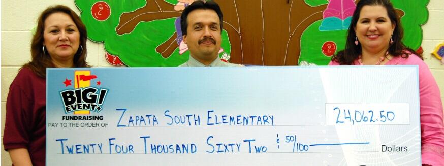 Zapata South Elementary School fundraising team holding check