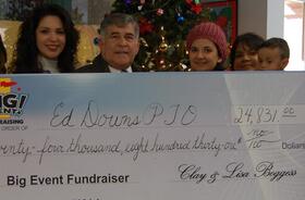Ed Downs Elementary School PTO fundraising team holding check