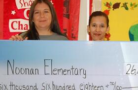 Noonan Elementary School fundraising team holding check