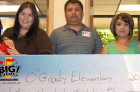 O'Grady Elementary School fundraising team holding check