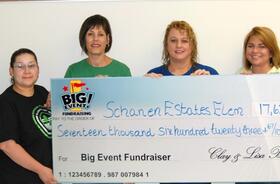 Schanen Estates Elementary School fundraising team holding check