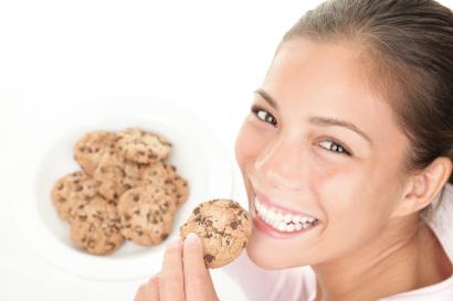 Girl enjoying chocolate chip cookie
