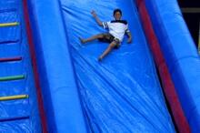 student-on-slide-super-party-event.jpg